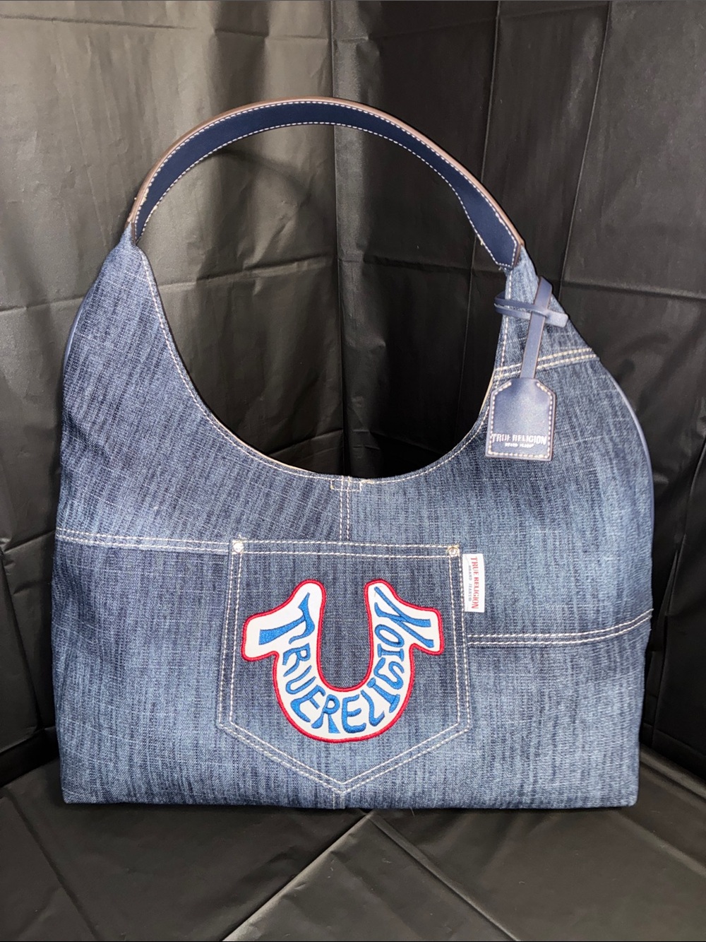 True Religion Denim Shoulder Bag with Blue, Red and White Logo
